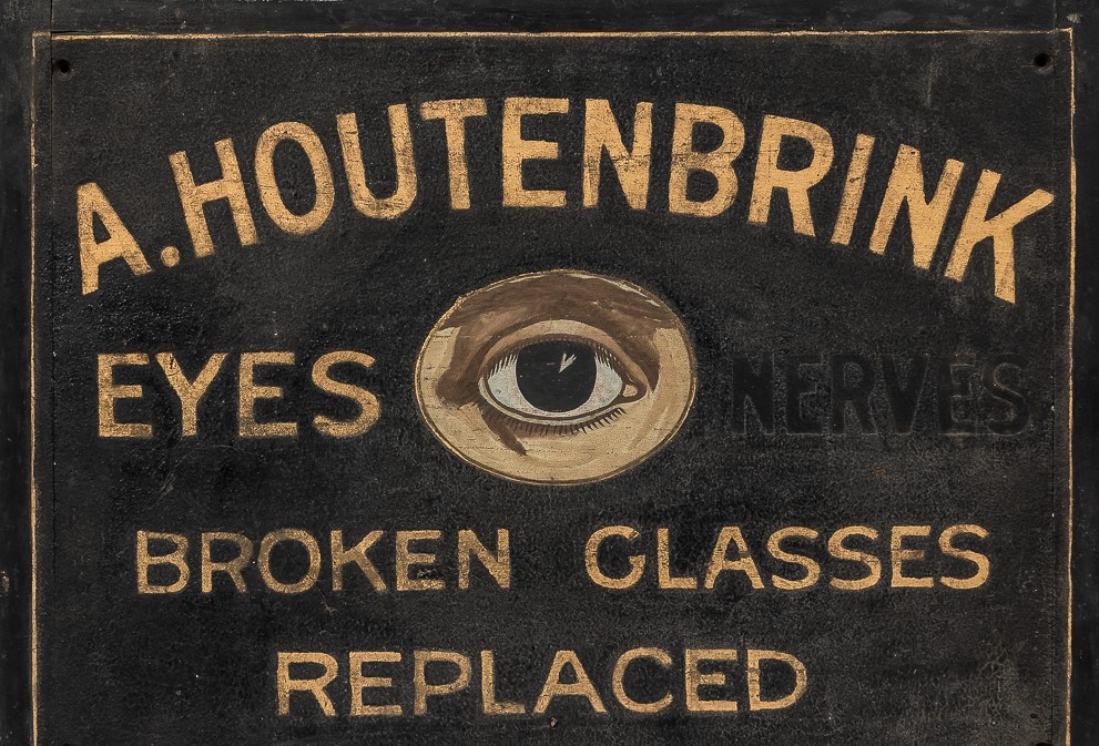 WOOD TRADE SIGN  WITH PAINTED EYES REPAIR