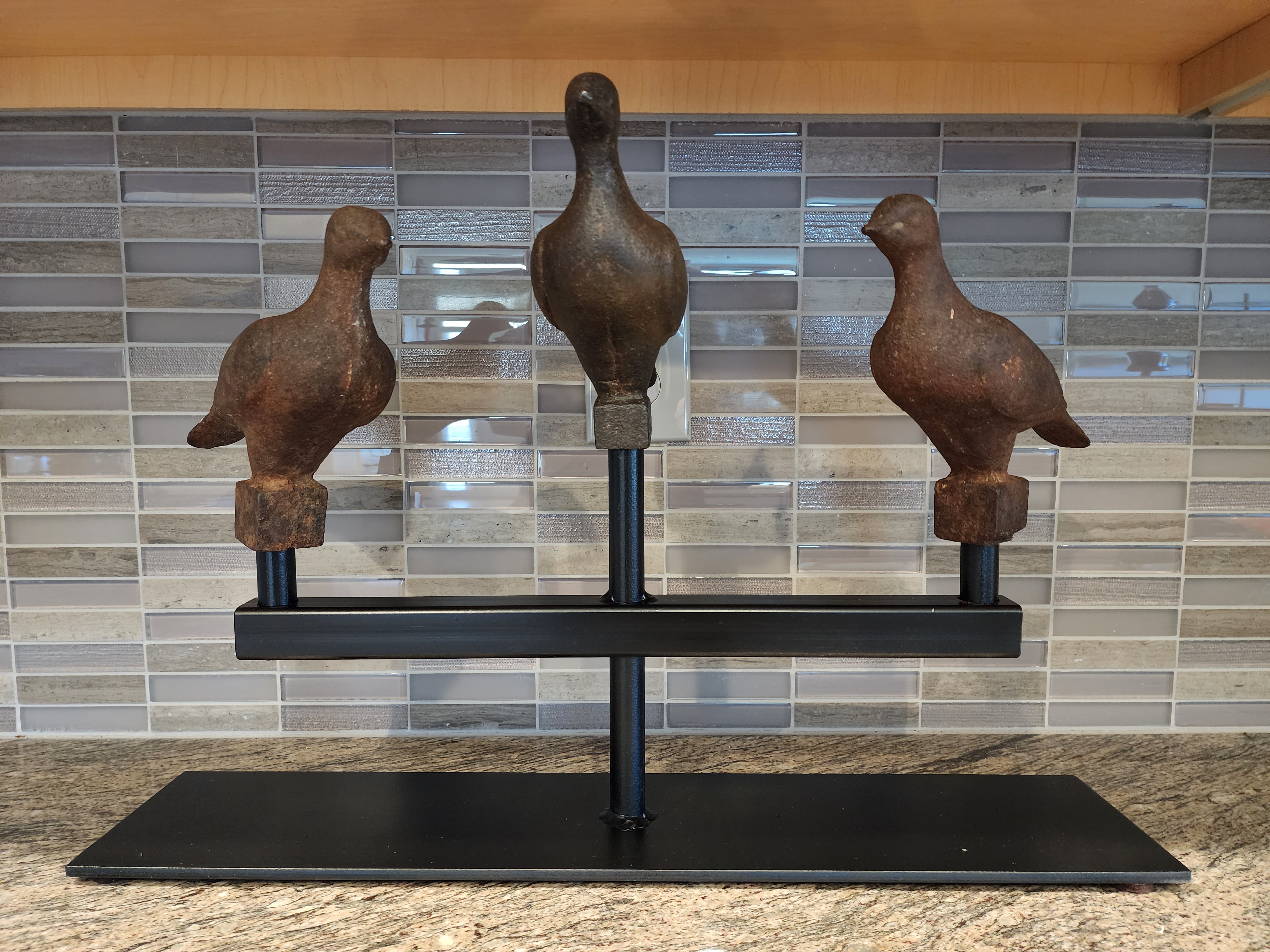 3 CAST IRON FINIALS IN THE FORM OF BIRDS
