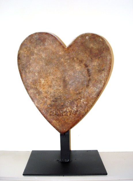 LARGE HEART WEIGHT IN OLD SURFACE