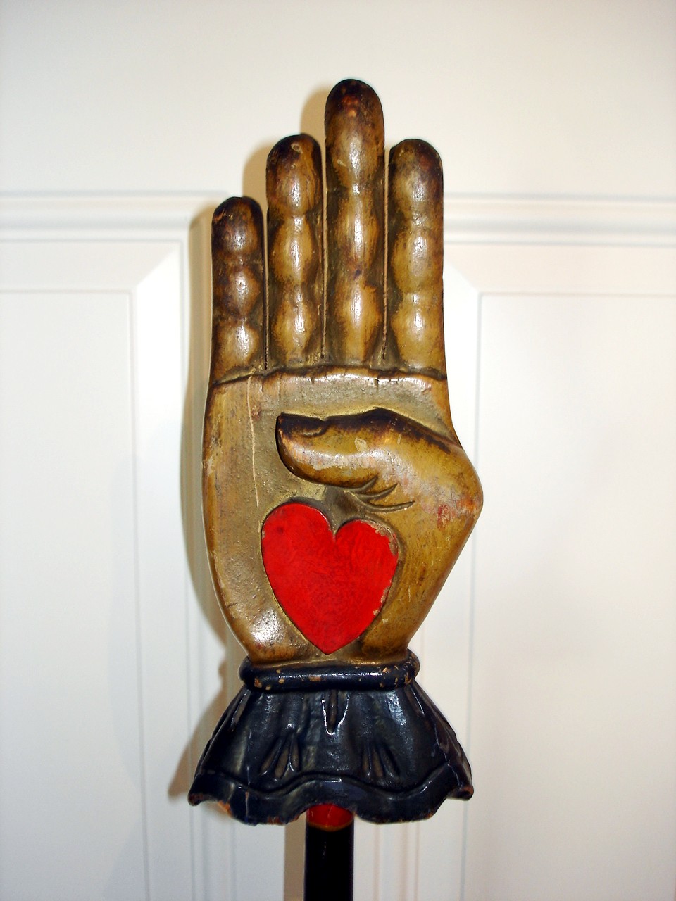 WOODEN CARVED HEART IN HAND