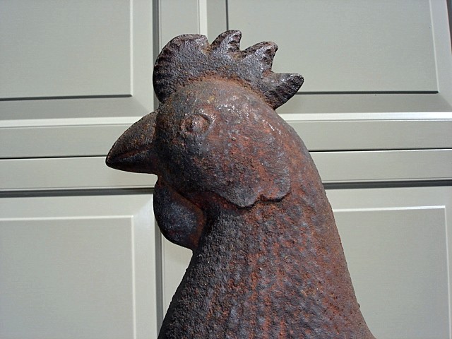 cast iron mogul rooster in old surface