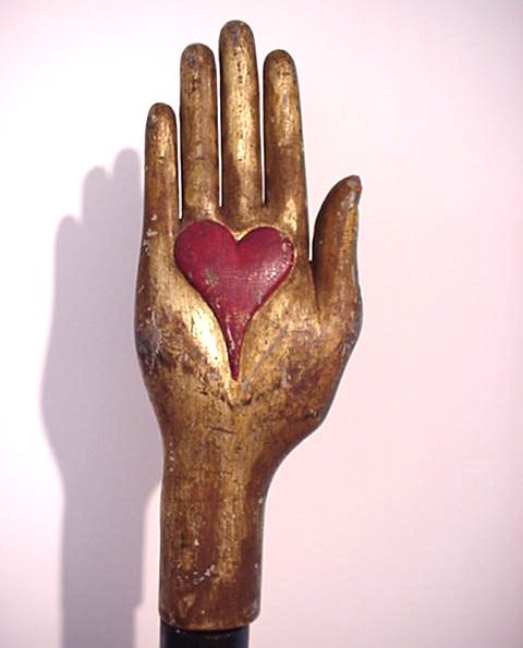 heart in hand with carved raised heart