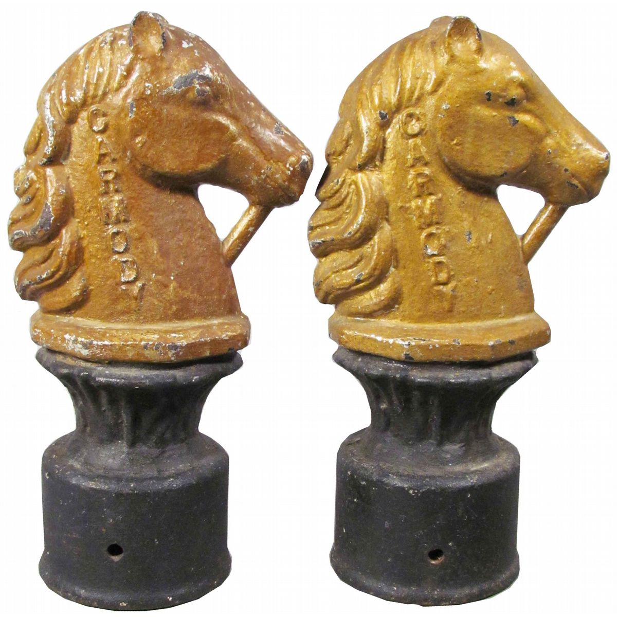 A PAIR OF CAST IRON HITCHING POSTS.